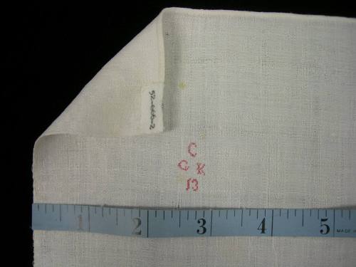 2009 Record shot by L. Baumgarten. Napkin, detail of mark & hem.