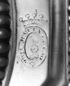 C74-382. Candlestick, crest.