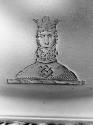 C74-384. Candlestick, crest of bearded and crowned man.